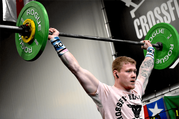 Athlete pressing a barbell overhead